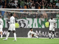 Real Madrid players react at the end of the Spanish league football match between Real Betis and Real Madrid CF at the La Cartuja stadium in Seville on April 24 , 2026. (Photo by CRISTINA QUICLER / AFP)