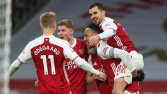 LONDON, ENGLAND - FEBRUARY 14: Pierre Emerick Aubameyang of Arsenal celebrates with team mates Martin Odegaard, Emile Smith Rowe and Dani Ceballos after scoring their side&#039;s second goal the Premier League match between Arsenal and Leeds United at Emi