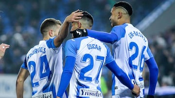 LEGANES, SPAIN - DECEMBER 08: Oscar Rodriguez of Leganes celebrates his goal with Youssef En-Nesyri of Leganes and Kevin Rodrigues of Leganes during La Liga football match, played between Leganes and Celta de Vigo at Butarque stadium on December 08, 2019