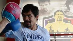 Pacquiao se entrena en Filipinas con una camiseta con el lema 'Preferiría estar en Río'.