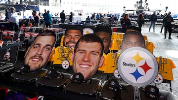 Oversized pictures of Pittsburgh Steelers players sit in the seats of Steeler fans who will be inside the NFL draft theater in the background before the start of the 2024 NFL draft in Detroit.