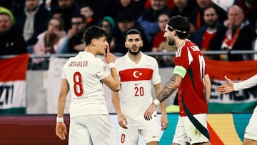 BUDAPEST, HUNGARY - MARCH 23: Arda Gueler of Turkiye gestures to Dominik Szoboszlai of Hungary during the UEFA Nations League 2024/25 League A/B Play-offs Second Leg match between Hungary and Türkiye at Puskas Arena on March 23, 2025 in Budapest, Hungary. (Photo by David Balogh/Getty Images)
