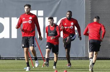 Toronto FC defender Omar Gonzalez, left, midfielder Jonathan Osorio and forward Jozy Altidore, right, participate in a training session