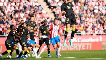 Almeria's Brazilian forward #12 Leo Baptistao heads the ball during the Spanish league football match between Girona FC and UD Almeria at the Montilivi stadium in Girona on October 22, 2023. (Photo by Pau BARRENA / AFP)