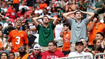 Sep 4, 2021; Atlanta, Georgia, USA; Miami Hurricanes fans react after Miami turned the ball over on downs during the third quarter against the Alabama Crimson Tide at Mercedes-Benz Stadium. Mandatory Credit: Jason Getz-USA TODAY Sports