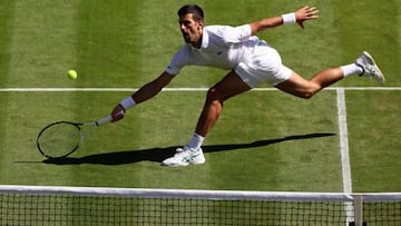 LONDON, ENGLAND - JULY 01:  Novak Djokovic of Serbia stretches to play a forehand volley against Miomir Kecmanovic of Serbia during their Men's Singles Third Round match on day five of The Championships Wimbledon 2022 at All England Lawn Tennis and Croquet Club on July 01, 2022 in London, England (Photo by Clive Brunskill/Getty Images)