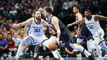 Dec 3, 2024; Dallas, Texas, USA; Dallas Mavericks guard Luka Doncic (77) dribbles as Memphis Grizzlies center Jay Huff (30) defends during the second half at American Airlines Center. Mandatory Credit: Kevin Jairaj-Imagn Images