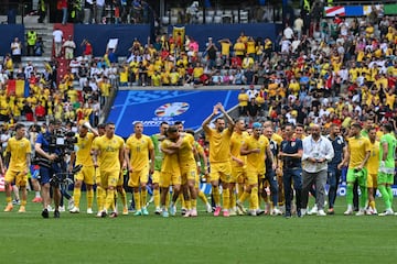 Romania's players celebrate at the end of the UEFA Euro 2024 Group E football match between Romania and Ukraine at the Munich Football Arena in Munich on June 17, 2024. (Photo by Miguel MEDINA / AFP)