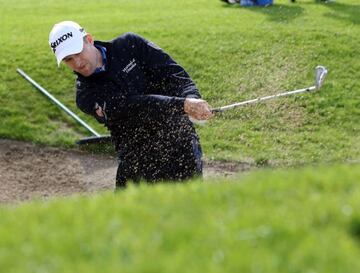 Knox plays out of a bunker on the 18th hole during his final round 68.