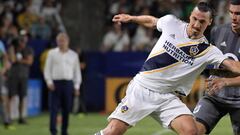 Aug 11, 2018; Carson, CA, USA; LA Galaxy forward Zlatan Ibrahimovic (9) battles for the ball with Minnesota United FC midfielder Miguel Ibarra (10) and defender Michael Boxall (15)  in the first half at StubHub Center. Mandatory Credit: 