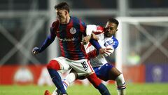 San Lorenzo's Slovenian forward Andres Vombergar (L) and Fortaleza's defender Bruno Pacheco vie for the ball during the Copa Sudamericana group stage first leg football match between San Lorenzo and Fortaleza at the Pedro Bidegain stadium in Buenos Aires on April 20, 2023. (Photo by EMILIANO LASALVIA / AFP)