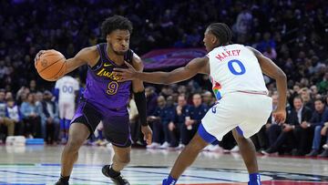 PHILADELPHIA, PENNSYLVANIA - JANUARY 28: Bronny James #9 of the Los Angeles Lakers makes a move against Tyrese Maxey #0 of the Philadelphia 76ers in the first half at the Wells Fargo Center on January 28, 2025 in Philadelphia, Pennsylvania. NOTE TO USER: User expressly acknowledges and agrees that, by downloading and/or using this photograph, user is consenting to the terms and conditions of the Getty Images License Agreement. Mitchell Leff/Getty Images/AFP (Photo by Mitchell Leff / GETTY IMAGES NORTH AMERICA / Getty Images via AFP)