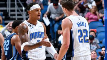 ORLANDO, FL - OCTOBER 11: Paolo Banchero #5 high fives Franz Wagner #22 of the Orlando Magic during the game against the Memphis Grizzlies on October 11, 2022 at Amway Center in Orlando, Florida. NOTE TO USER: User expressly acknowledges and agrees that, by downloading and or using this photograph, User is consenting to the terms and conditions of the Getty Images License Agreement. Mandatory Copyright Notice: Copyright 2022 NBAE (Photo by Fernando Medina/NBAE via Getty Images)