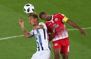 Soccer Football - FIFA Club World Cup - CF Pachuca vs Wydad AC - Zayed Sports City Stadium, Abu Dhabi, United Arab Emirates - December 9, 2017   Pachuca's Keisuke Honda in action with Wydad’s Brahim Nakach   REUTERS/Ahmed Jadallah