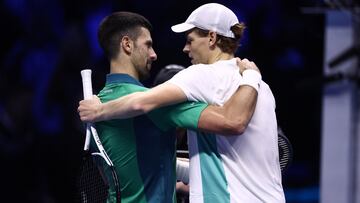 Tennis - ATP Finals - Pala Alpitour, Turin, Italy - November 15, 2023 Italy's Jannik Sinner speaks to Serbia's Novak Djokovic after winning their group stage match REUTERS/Guglielmo Mangiapane