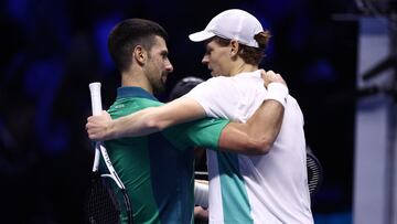 Tennis - ATP Finals - Pala Alpitour, Turin, Italy - November 15, 2023 Italy's Jannik Sinner speaks to Serbia's Novak Djokovic after winning their group stage match REUTERS/Guglielmo Mangiapane