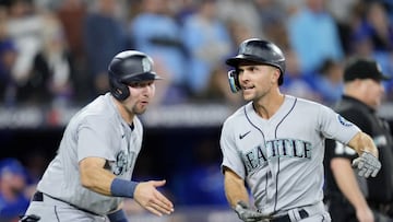 TORONTO, ONTARIO - OCTOBER 08: Mitch Haniger #17 of the Seattle Mariners celebrates after scoring on a double hit by J.P. Crawford #3 against the Toronto Blue Jays during the eighth inning in game two of the American League Wild Card Series at Rogers Centre on October 08, 2022 in Toronto, Ontario. (Photo by Mark Blinch/Getty Images)