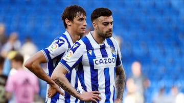 Real Sociedad's French defender Robin Le Normand (L) and Real Sociedad's Spanish defender Diego Rico react at the end of the Spanish League football match between Real Sociedad and RC Celta de Vigo at the Reale Arena stadium in San Sebastian, on February 18, 2023. (Photo by ANDER GILLENEA / AFP)