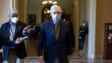 US Senate Majority Leader Mitch McConnell walks from the Senate floor after the summer legislative session adjourned without a deal being reached on a coronavirus stimulus package.