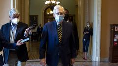 US Senate Majority Leader Mitch McConnell walks from the Senate floor after the summer legislative session adjourned without a deal being reached on a coronavirus stimulus package.