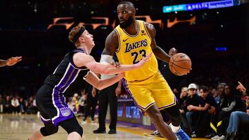 Mar 6, 2024; Los Angeles, California, USA;  Los Angeles Lakers forward LeBron James (23) moves the ball against Sacramento Kings guard Kevin Huerter (9) during the second half at Crypto.com Arena. Mandatory Credit: Gary A. Vasquez-USA TODAY Sports