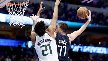 Luka Doncic #77 of the Dallas Mavericks drives to the basket against Hassan Whiteside #21 of the Utah Jazz