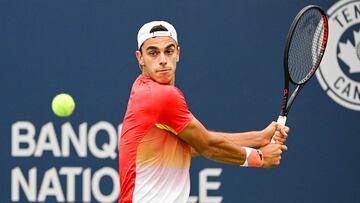 Aug 8, 2022; Montreal, Quebec, Canada; Francisco Cerundolo (ARG) hits a shot against Karen Khachanov (RUS) (not pictured) during first round play at IGA Stadium. Mandatory Credit: David Kirouac-USA TODAY Sports