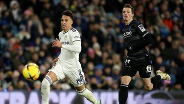LEEDS, ENGLAND - DECEMBER 16: Rodrigo of Leeds advances under pressure from Jon Pacheco of Real Sociedad during the friendly match between Leeds United and Real Sociedad at Elland Road on December 16, 2022 in Leeds, England. (Photo by Jan Kruger/Getty Images)