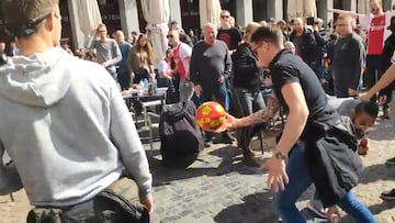 Ajax ultras have a game of 'hit the flag' in Madrid's Plaza Mayor