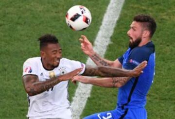 Boateng (left) and Giroud challenge for an aerial ball.