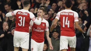 Arsenal's Aaron Ramsey, center, celebrates after scoring his side's first goal during the Europa League first leg quarterfinal soccer match between Arsenal and Napoli at Emirates stadium in London, Thursday, April 11, 2019. (AP Photo/Kirsty Wigg