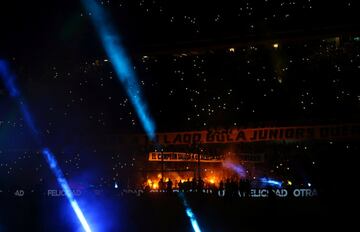 Boca Juniors' fans light flares as they celebrate. 