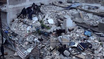 EDITORS NOTE: Graphic content / Residents search for victims and survicors amidst the rummble of a building that collapsed, following an earthquake in the village of Azmarin, near the Turkish border in the north of Syria's rebel-held northwestern Idlib province, early on February 6, 2023. - At least 100 have been reportedly killed in north Syria after a 7.8-magnitude earthquake that originated in Turkey and was felt across neighbouring countries. (Photo by OMAR HAJ KADOUR / AFP) (Photo by OMAR HAJ KADOUR/AFP via Getty Images)