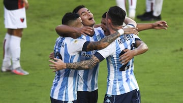 AVELLANEDA, ARGENTINA - APRIL 25:  Juan Caceres of Racing Club celebrates with teammates Carlos Alcarez, Leonel Miranda and Anibal Moreno after scoring the second goal of his team during a match between Racing Club and Colon as part of Copa de la Liga Profesional 2021 at Juan Domingo Peron Stadium on April 25, 2021 in Avellaneda, Argentina. (Photo by Rodrigo Valle/Getty Images)