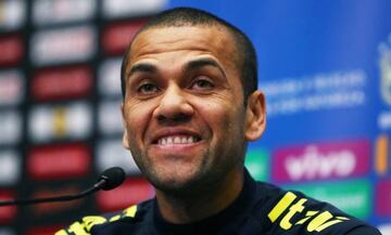 Dani Alves shares a smile with the press ahead of Brazil's game with England.