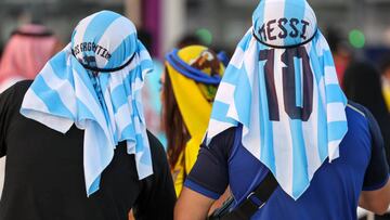 AL KHOR, QATAR - NOVEMBER 20: Fans of Argentina wearing Lionel Messi traditional Arab headdress / keffiyeh or shemagh prior to the FIFA World Cup Qatar 2022 Group A match between Qatar and Ecuador at Al Bayt Stadium on November 20, 2022 in Al Khor, Qatar. (Photo by Matthew Ashton - AMA/Getty Images)