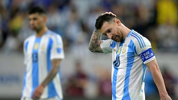 (FILES) Argentina's forward #10 Lionel Messi gestures after Ecuador tied the match and before a penalty shoot out during the Conmebol 2024 Copa America tournament quarter-final football match between Argentina and Ecuador at NRG Stadium in Houston, Texas, on July 4, 2024. Argentina's forward Lionel Messi was ruled out for Argentina�s World Cup Qualifiers against Brazil and Uruguay on March 17, 2025, according to the list of called-up players posted on the AFA (Argentina Football Association) official X account. (Photo by JUAN MABROMATA / AFP)