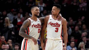 PORTLAND, OREGON - DECEMBER 06: Damian Lillard #0 of the Portland Trail Blazers tries to speak with CJ McCollum #3 after McCollum drew a technical foul during the second half of the game against the Los Angeles Lakers at Moda Center on December 06, 2019 in Portland, Oregon. The Lakers won 136-113. NOTE TO USER: User expressly acknowledges and agrees that, by downloading and or using this photograph, User is consenting to the terms and conditions of the Getty Images License Agreement.   Steve Dykes/Getty Images/AFP
 == FOR NEWSPAPERS, INTERNET, TELCOS &amp; TELEVISION USE ONLY ==