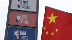 NBA logos are seen next to a Chinese national flag outside a NBA-themed lifestyle complex on the outskirts of Tianjin, China, October 10, 2019. REUTERS/Jason Lee