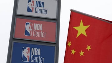 NBA logos are seen next to a Chinese national flag outside a NBA-themed lifestyle complex on the outskirts of Tianjin, China, October 10, 2019. REUTERS/Jason Lee