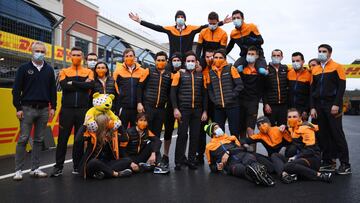 ISTANBUL, TURKEY - NOVEMBER 15: Lando Norris of Great Britain and McLaren F1 and team members pose with a Pudsey Bear toy on the grid after the F1 Grand Prix of Turkey at Intercity Istanbul Park on November 15, 2020 in Istanbul, Turkey. (Photo by Clive Mason/Getty Images)