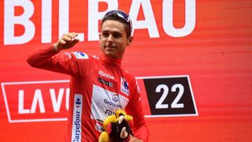 Team Groupama-FDJ's French rider Rudy Molard celebrates on the podium wearing the overall leader's red jersey after the 5th stage of the 2022 La Vuelta cycling tour of Spain, a 187.2 km race from Irun to Bilbao, on August 24, 2022. (Photo by ANDER GILLENEA / AFP) (Photo by ANDER GILLENEA/AFP via Getty Images)