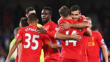 Goalscorers Jordan Henderson (14) and Dejan Lovren of Liverpool (6) celebrate victory after the Premier League match between Chelsea and Liverpool at Stamford Bridge on September 16, 2016