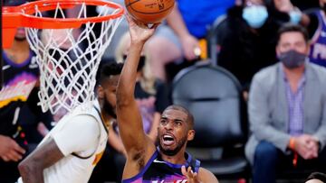 Jun 7, 2021; Phoenix, Arizona, USA; Phoenix Suns guard Chris Paul (3) drives to the basket against the Denver Nuggets in the second half during game one in the second round of the 2021 NBA Playoffs at Phoenix Suns Arena. Mandatory Credit: Mark J. Rebilas-USA TODAY Sports