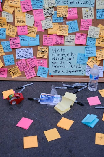 Messages are pinned to a cork board inside an area called by protesters the Capitol Hill Autonomous Zone (CHAZ) in Seattle, Washington, U.S. 11 June 2020.