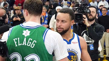 Dec 25, 2025; San Francisco, California, USA; Golden State Warriors guard Stephen Curry (30) and Dallas Mavericks forward Cooper Flagg (center left) greet each other after the game at Chase Center. Mandatory Credit: Darren Yamashita-Imagn Images
