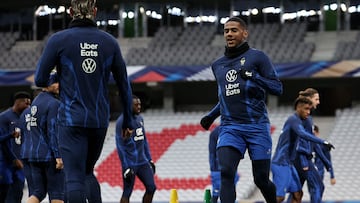 France's defender Jean Clair Todibo (R) takes part in a training session at Pierre-Mauroy stadium in Lille, northern France on October 16, 2023, on the eve of a friendly football match against Scotland. (Photo by FRANCK FIFE / AFP)