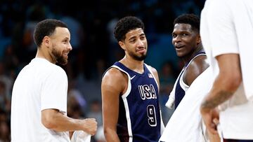 USA's #04 Stephen Curry, USA's #09 Tyrese Haliburton and USA's #05 Anthony Edwards react at the end of the men's preliminary round group C basketball match between Puerto Rico and USA during the Paris 2024 Olympic Games at the Pierre-Mauroy stadium in Villeneuve-d'Ascq, northern France, on August 3, 2024.