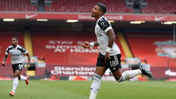Fulham&#039;s Gabonese midfielder Mario Lemina (C) celebrates after scoring the opening goal of the English Premier League football match between Liverpool and Fulham at Anfield in Liverpool, north west England on March 7, 2021. (Photo by PHIL NOBLE / POO