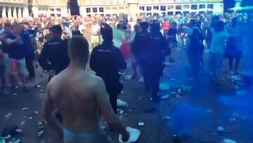 Leicester fans throw cans and bottles as riot police move in